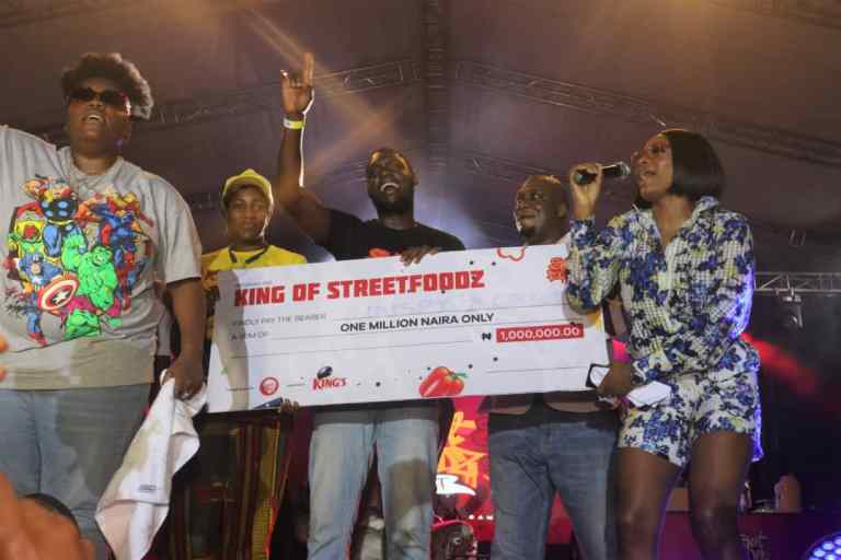 Teni during the presentation of cheque 1