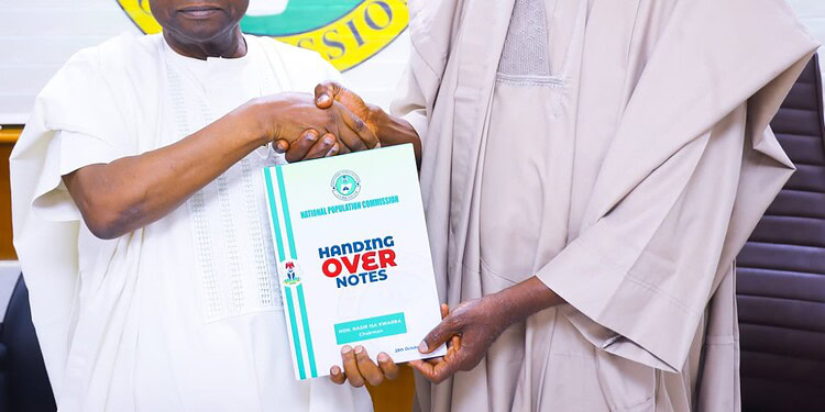 National Population Commission leaders shaking hands during official handover of population data, showcasing government collaboration on demographic information and statistics in Nigeria.