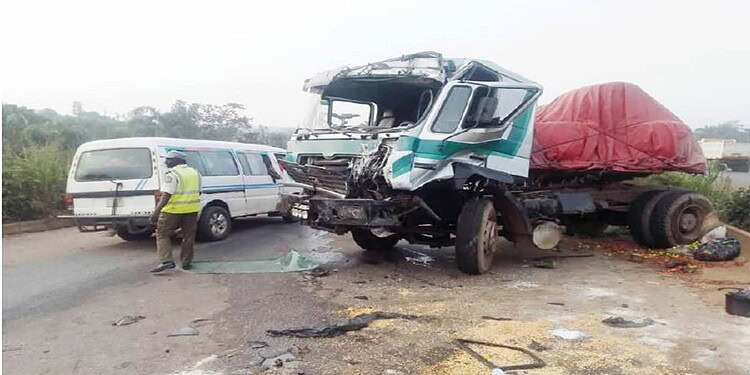 Damaged truck collision with a minibus on the road after an accident, emergency response scene, commercial vehicle crash, traffic accident scene, accident investigation for roadway safety.