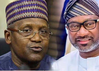 Prominent Nigerian political leaders engaged in a discussion at a formal event, wearing traditional attire and hats, highlighting leadership and cultural heritage.