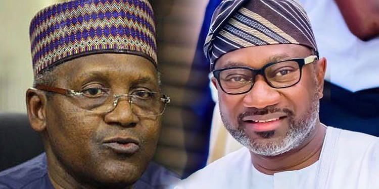 Prominent Nigerian political leaders engaged in a discussion at a formal event, wearing traditional attire and hats, highlighting leadership and cultural heritage.