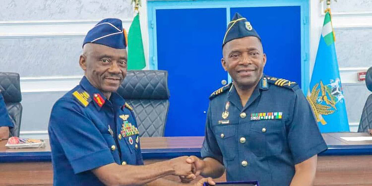 Honourable military officers shaking hands during an award ceremony at Freelanews, highlighting leadership, recognition, and military achievements in a professional setting.