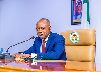 Senior government official at Enugu State Government Office, Nigeria, during official duties or press conference, showcasing leadership and governance in Nigeria.