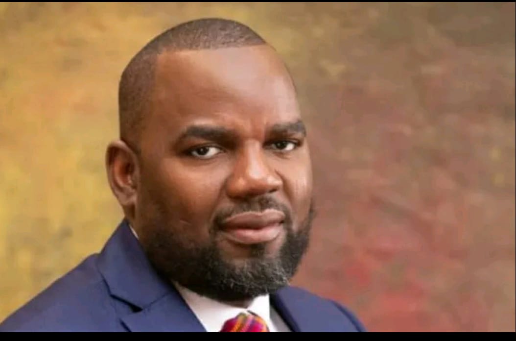 Business professional portrait of a confident African man in formal suit, suitable for financial or corporate news articles, freelance work, or leadership features.