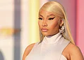 Vibrant portrait of a confident woman with platinum blonde hair and bold makeup, showcasing beauty, fashion, and modern style from Freelanews.