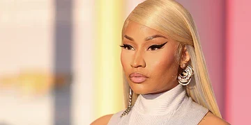 Vibrant portrait of a confident woman with platinum blonde hair and bold makeup, showcasing beauty, fashion, and modern style from Freelanews.