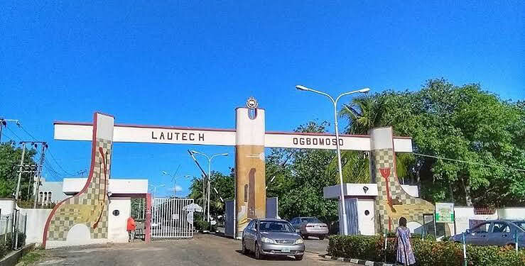 Lautech Ogbomoso university entrance gate in Nigeria under a clear blue sky with surrounding greenery.