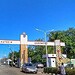 Lautech Ogbomoso university entrance gate in Nigeria under a clear blue sky with surrounding greenery.
