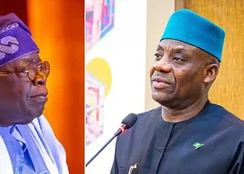 Highly detailed image of two prominent Nigerian political figures engaged in a serious discussion, wearing traditional attire and headgear, capturing a moment of political significance and leadership in Nigeria.