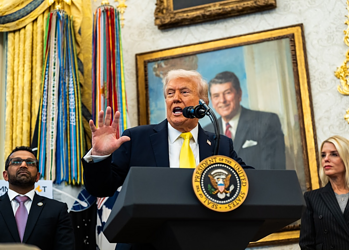 Donald Trump speaking at a podium with the presidential seal, flanked by his advisors, in a room decorated with gold accents and large portraits.