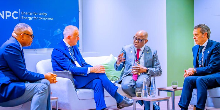 Innovative energy leaders engaging in a strategic discussion at a professional conference, emphasising renewable energy and global sustainability initiatives.