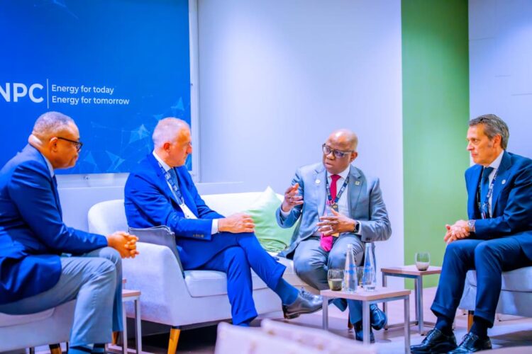 Innovative energy leaders engaging in a strategic discussion at a professional conference, emphasising renewable energy and global sustainability initiatives.