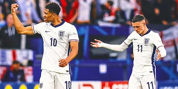 England football players celebrating during a match, wearing white kits with navy details, on a vibrant stadium pitch. Focus on player number 10 and 11, showcasing teamwork and national team spirit in international football.