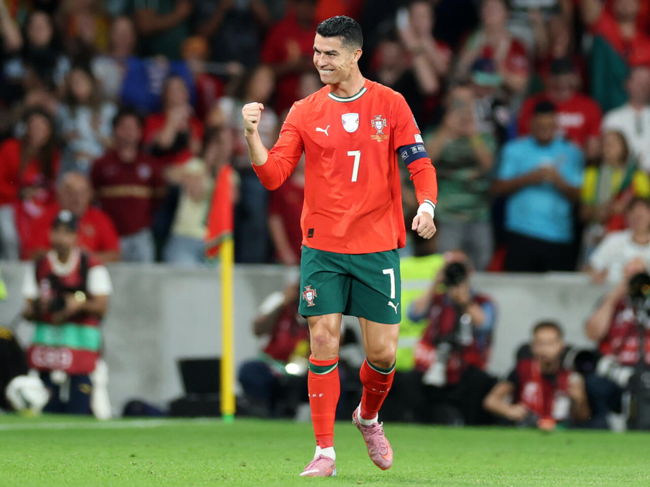 Dynamic moment capturing the soccer star's triumphant gesture in a packed stadium, highlighting his leadership and excellence in international football.