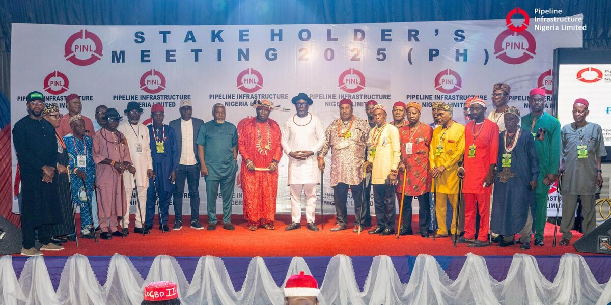 Stakeholders gather on stage during Nigeria pipeline infrastructure meeting, showcasing diverse traditional and modern attire at the 2025 pipeline infrastructure conference, highlighting Nigerian energy sector development.