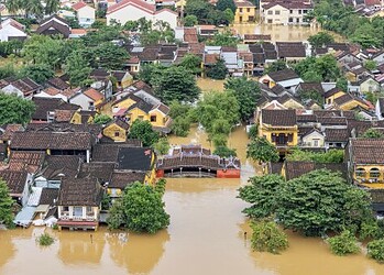 Flooded residential area in a urban neighbourhood with water submerging houses and streets after heavy rain in the UK.
