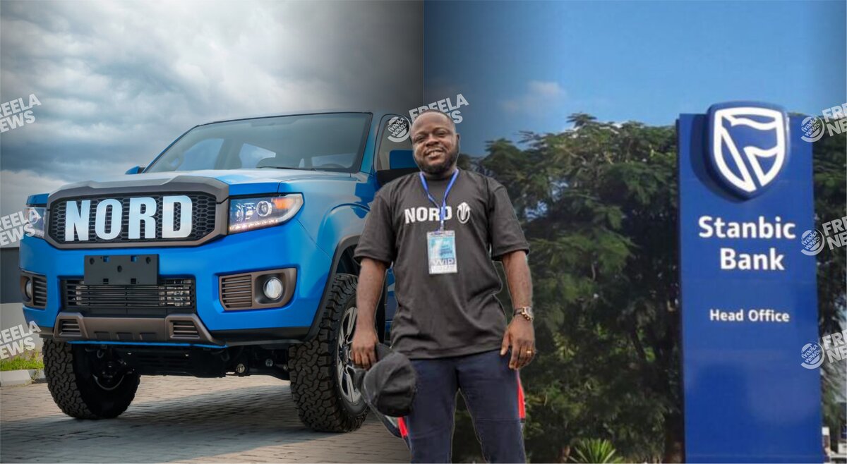 Nord-branded man standing in front of a blue off-road vehicle and a Stanbic Bank sign, at a corporate event or exhibition; highlighting automotive and banking industry partnership.
