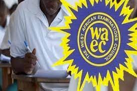 A man signing a document during the West African African Examination Council (WAEC) exam in Nigeria; focus on exam process, education, and certification.