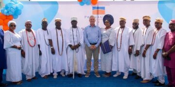 Chief Executive Officer of Promasidor Nigeria, François Gillet (Middle), with His Royal Majesty, Oba Isa Abiodun Faronbi-Shekoni, the Osolo of Isolo Kingdom (5th Left); his wife, Olori Tawakalitu Abike Faronbi-Shekoni (6th Right); and members of the royal cabinet, during the donation of a water tower and borehole system to the palace of the Osolo of Isolo Kingdom in Lagos, on Thursday, 21st May 2026.